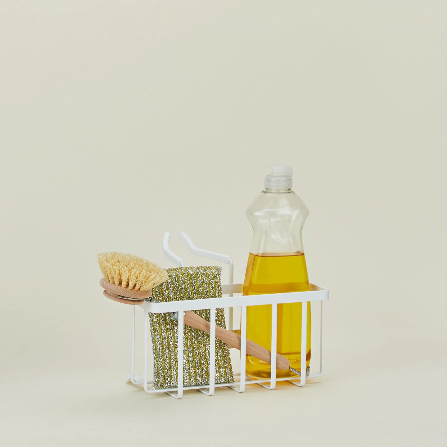 Golden Linen Hanging Sponge Caddy attached to kitchen faucet